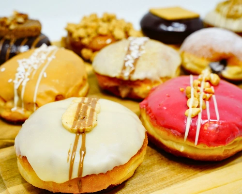 Box of gender reveal donuts for a party